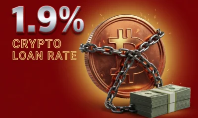 Bitcoin coin chained to a stack of cash representing Blockchain.com 1.9 percent crypto loan launch.