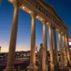 Caesars Palace facade lit at twilight ahead of Fertitta acquisition closing.