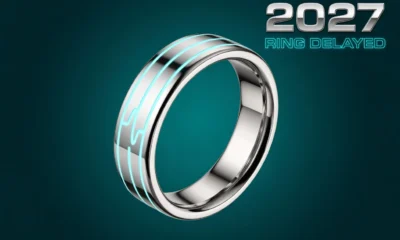 Chrome titanium smart ring with glowing health pulse line orbit on deep teal background.