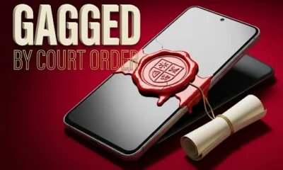 Indian budget smartphone sealed shut by a red wax court-order stamp on its glass screen.