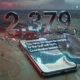 Smartphone displaying a fragmented WhatsApp threat message beside a US Marine helmet outline under red warning glow