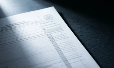 Binance MLP stock delisting K-1 tax compliance non-US investors