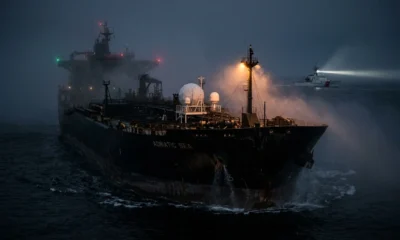 Dark fleet oil tanker with satellite comms at night
