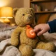 Haivivi BubblePal AI companion toy clipped to plush teddy bear