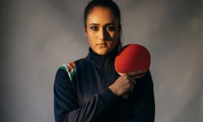 Manika Batra in India table tennis kit holding paddle