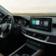 NHN Bugs essential app on Hyundai Pleos Connect car infotainment dashboard.