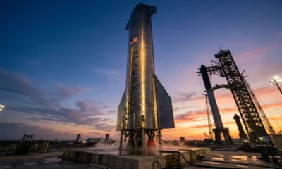 SpaceX Starship rocket on launch pad pre-dawn before IPO listing