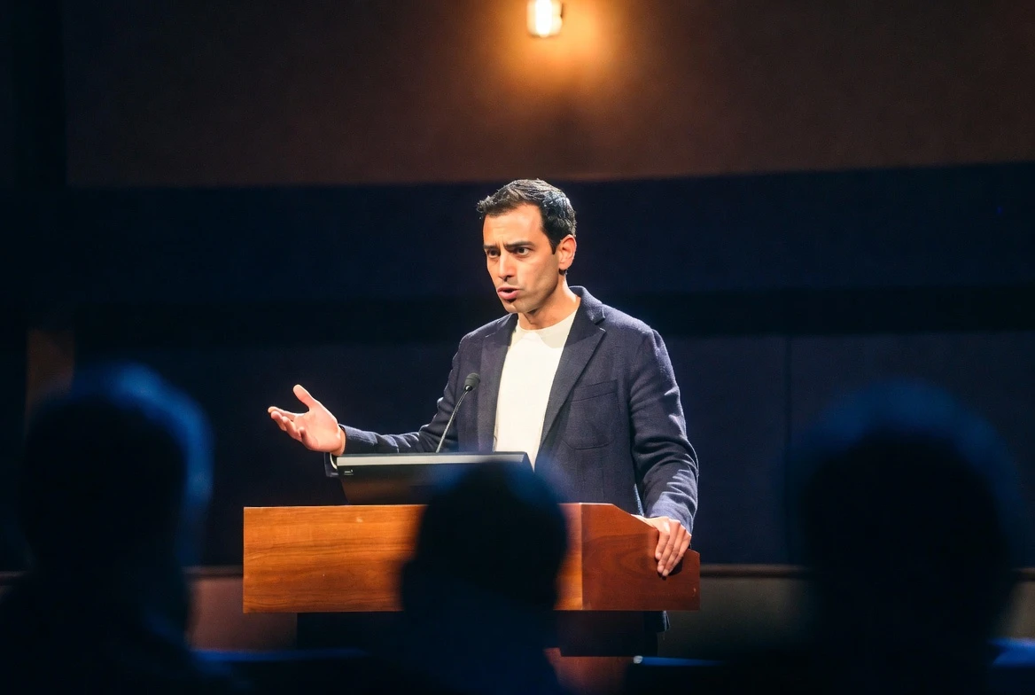 Google DeepMind philosopher Iason Gabriel at lectern