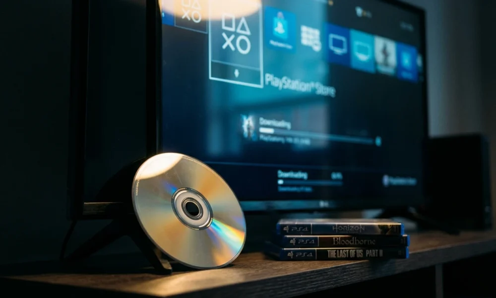 PlayStation game disc resting against modern TV base